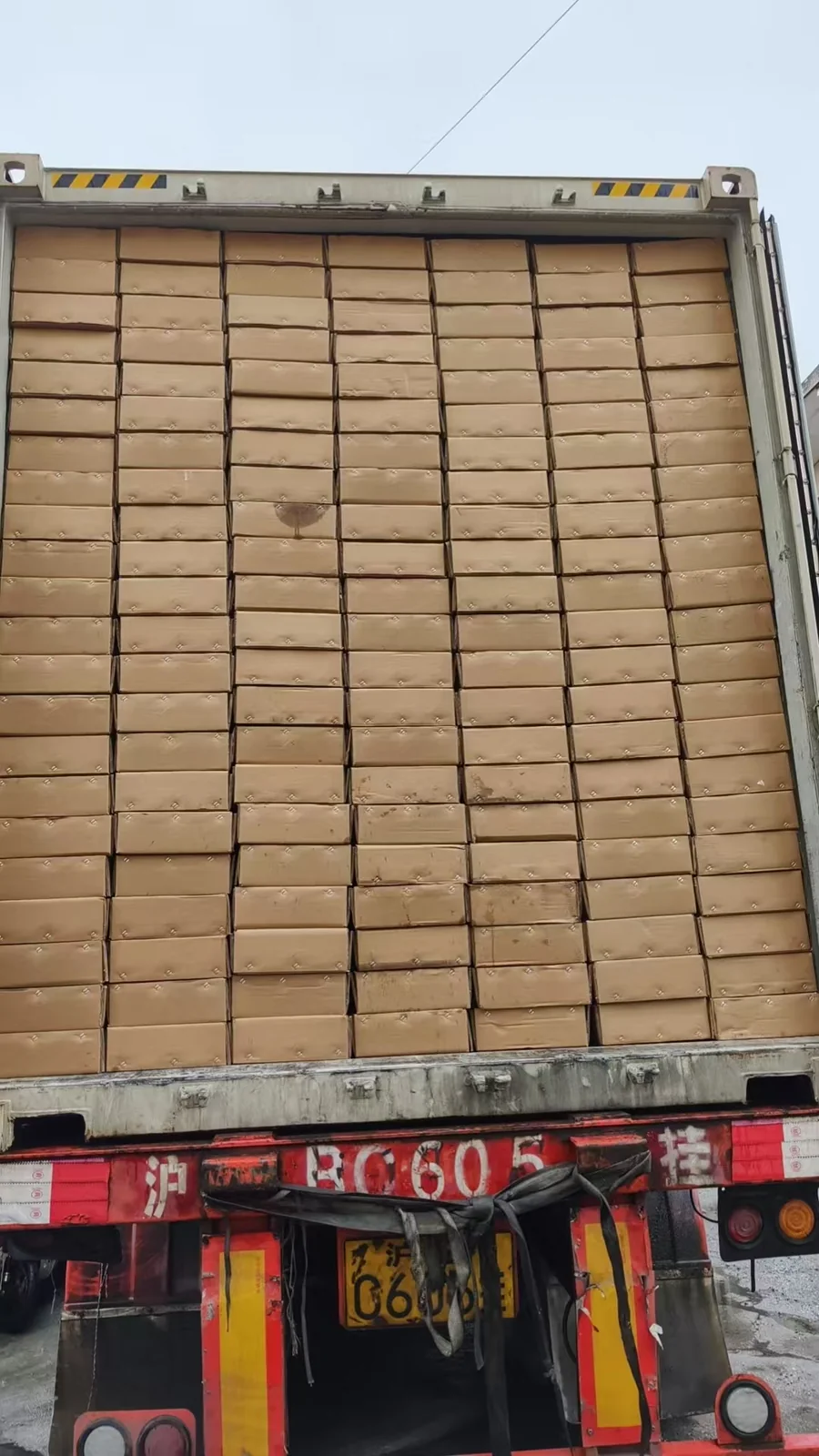 Cartons stacked inside a shipping container